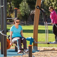 social fitness space in use by three women on proludic equipment