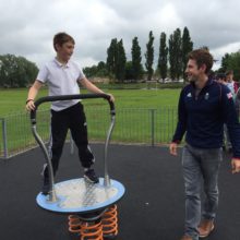 School Boy playing on Proludic Adventure Play Children's Play Equipment at West Park
