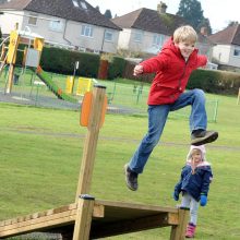 HarpendenTownCouncil Picture 9 version 2 of boy leaping off of adventure play platform