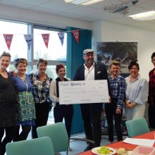 Put the fun back into fundraising image 7 proludic team holding cheque