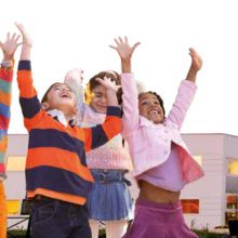 Happy Children raising their arms in glee