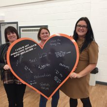 I love my Proludic Sports App reasons - group from Thornley Parish Council holding heart shaped chalk board